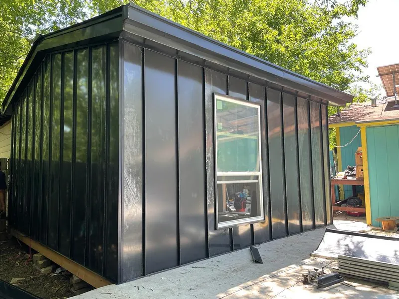 Black standing seam metal wall panels for Metal Roof Installation in Salamanca