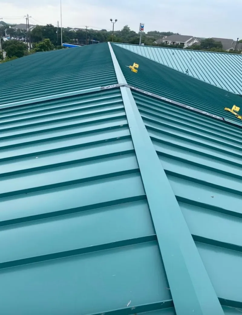 Green commercial metal roof ridge and valley for Metal Roof Repair in Salamanca